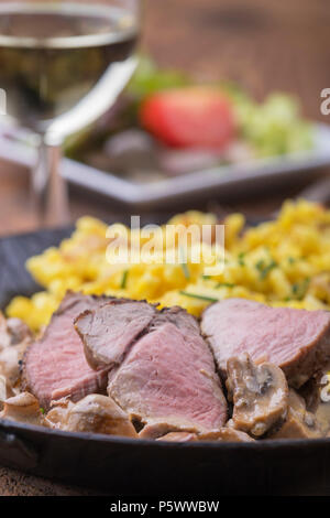 swabian pork filet with spaetzle and wine Stock Photo