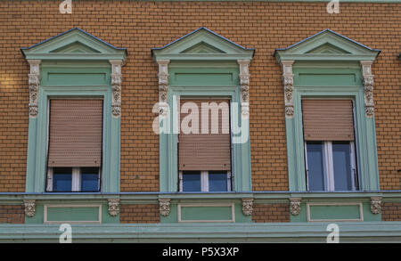 Windows on an old restored 19th century building Stock Photo - Alamy
