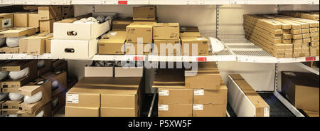 packages are stored on the Ikea shelves Stock Photo