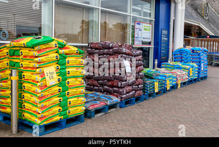Bags of potting compost stacked up outside a Tesco supermarket Stock Photo