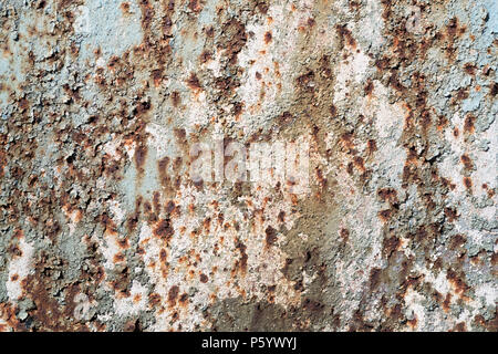 Grunge texture of old cracked paint with cracks and rust spots. Blue rough rustic background. Textured wall. Stock Photo