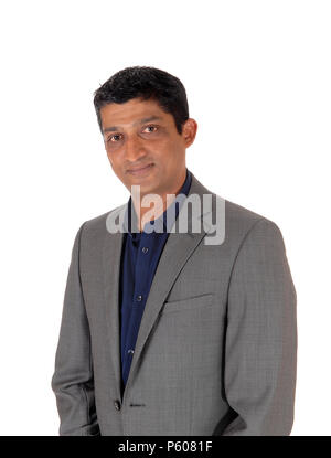 A close up image of the portrait of a east Indian business man in a gray suit, isolated for white background Stock Photo