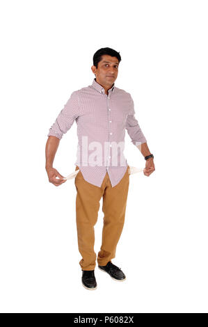 A full lengths image of an Asian man showing the empty pockets he is a very poor man, isolated for white background Stock Photo