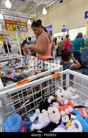 People shop for bargains in a nearly empty Toys R Us store three days before its closure. Toys R Us announced its liquidation on March 15, 2018. Stock Photo