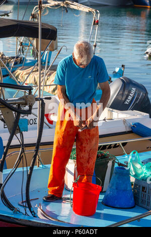 Local fisherman standing in the sea, holding a fishing rod to catch fish,  Lombok Island, Lesser Sunda Islands, Indonesia, Asia Stock Photo - Alamy