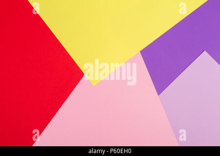Color papers geometry flat composition background with violet, purple, pink, red, yellow tones. Stock Photo