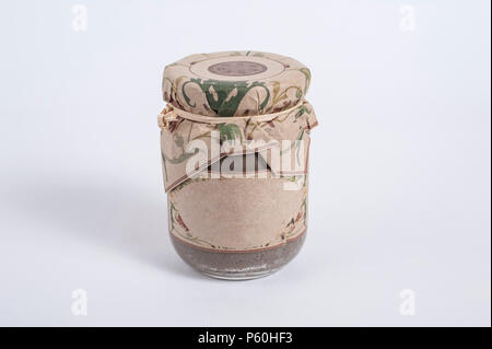 Small glass product jar with blank label for adding text isolated on a white background Stock Photo
