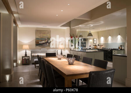 Modern dining room and kitchen at night Stock Photo