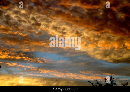 Dramatic sunset cloudy sky with clouds lit by sunset sunlight in San Antonio, Texas Stock Photo
