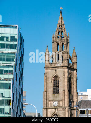 Close up view of ornate church spire with gold ship for navigation on top against blue sky Church of Our Lady and Saint Nicholas, Liverpool, England