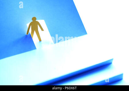 Exit concept. Paper man in open door before the stairs Stock Photo