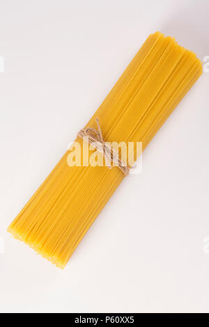 raw italian tagliatelle paste on a linen napkin close-up Stock Photo ...