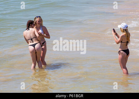 Young woman in thong bikini hi-res stock photography and images