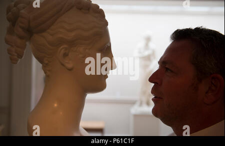 London Art Week, St James’s, London, UK. 28 June, 2018. A preview of galleries participating in London Art Week before official launch at 3.00pm on 28 June. Photo: Raffaello Tomasso with Portrait Bust of female Classical figure. Tomasso Brothers Fine Art gallery. Credit: Malcolm Park/Alamy Live News. Stock Photo
