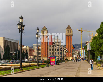 Barcelona, Spain - Pedestrian passing by the Venetian Towers in Square of Spain Stock Photo