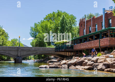 The Boathouse Cantina restaurant looks over the Arkansas River in the historic downtown district, small mountain town of Salida, Colorado, USA Stock Photo