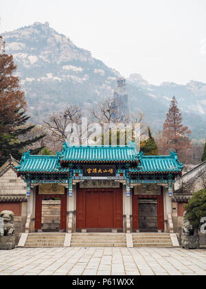Qingdao, China - December 2017: Entrance to the Taiqing temple or temple of Supreme Purity with the world's largest statue of Laozi in the back Stock Photo