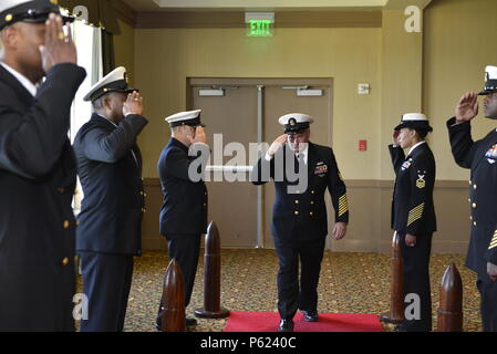 NORFOLK, Va. (Apr. 8, 2016) – Chief petty officers assigned to Pre-Commissioning Unit Gerald R. Ford (CVN 78) salute Master Chief Ship's Serviceman Kenneth Carter as he goes ashore for the last time at the conclusion of his retirement at Vista Point Conference Center at Naval Station Norfolk. Carter retired after 30 years of service in the Navy, originally reporting to Recruit Training Command in Orlando, Florida, in 1986. (U.S. Navy photo by Mass Communication Specialist Seaman Apprentice Gitte Schirrmacher/Released) Stock Photo