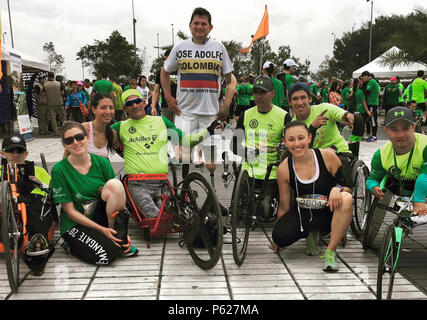 (Middle) Captain Tahina, 70th Intelligence, Surveillance and Reconnaissance Wing Plans and Programs chief, takes a group photo with Columbian wounded warriors in an 11K called Preste tu Pierna (Lend your Leg) April 5, 2016 in Columbia. The race was held to collect funds in support of Columbia’s Wounded Warriors and land mine victims, a project Tahina was a part of during her training as part of the Language Enabled Airman Program.  (Courtesy photo) Stock Photo