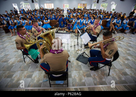 U.S. Marines with the U.S. Marine Corps Forces, Pacific band, brass quintet perform at the Manumalo Elementary and High School, American Samoa Apr. 14, 2016. The band traveled to American Samoa to participate in their annual Flag Day Ceremony. (U.S. Marine Corps Combat Camera photo by Sgt. William L. Holdaway/Released) Stock Photo