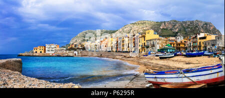 Traditional fishing boats and colorful houses in Aspra village,Bagheria,Sicily,Italy. Stock Photo