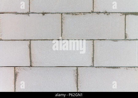 A wall of gray concrete blocks. Stock Photo