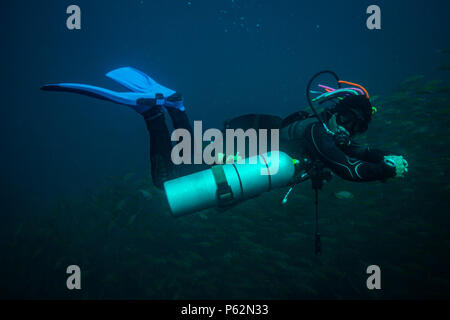 Scubadiver in a sidemount configuration of equipment Stock Photo - Alamy