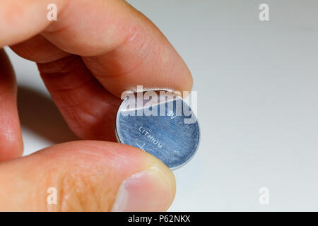 Silver Button Cell Battery On White Background Stock Photo