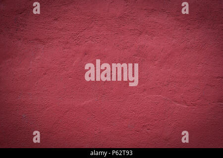 cemented wall painted red background. texture, vignette. Stock Photo