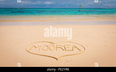 Summer beach concept: Written text surrounded with a shape of a heart on the beautiful beach of Moorea Island, French polynesia Stock Photo
