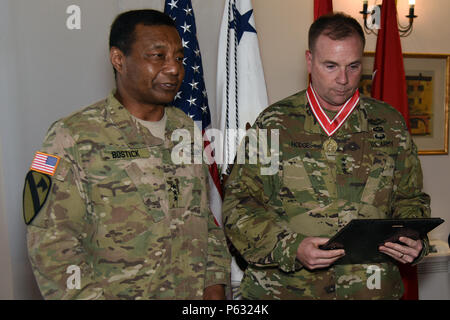 Lt. Gen. Thomas P. Bostick, (left), Chief of Engineers of the United States Army and Commanding General of the U.S. Army Corps of Engineers, and the Army Engineer Association Present Lt. Gen. Ben Hodges, (right), U.S. Army Europe Commanding General, the Bronze Order of the de Fleury Medal on 7 April 2016 on Clay Kaserne, in Wiesbaden, Germany.  The medal is in recognition of superior service to the Engineer Regiment as it supports the Army to assure mobility, enhance protection, enable expeditionary logistics, and build capacity in order to provide commanders with the freedom of action require Stock Photo