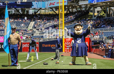 The San Diego Padres mascot, the Swinging Friar, greets Marines and sailors  with 3rd Battalion, 4th Marines, 7th Marine Regiment, during their  appearance at a military appreciation ceremony at a San Diego