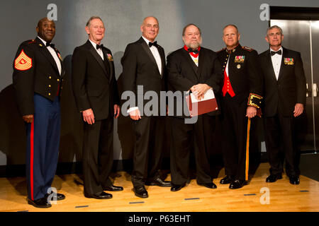From left, Sgt. Maj. of the Marine Corps Ronald L. Green, retired U.S. Marine Gen. Walter E. Boomer, retired Marine Gen. John F. Kelly, Mr. Oscar E. Gilbert, Commandant of the Marine Corps Gen. Robert B. Neller, and retired Marine Lt. Gen. Robert R. Blackman, Jr., pose for a group photo during the Marine Corps Heritage Foundation awards presentation at the National Museum of the Marine Corps, Triangle, Va., April 23, 2016. Gilbert and Mr. Romain Cansiere were recipients of the General Wallace M. Greene, Jr. award for their book, 'Tanks in Hell: A Marine Corps Tank Company on Tarawa.' (U.S. Mar Stock Photo