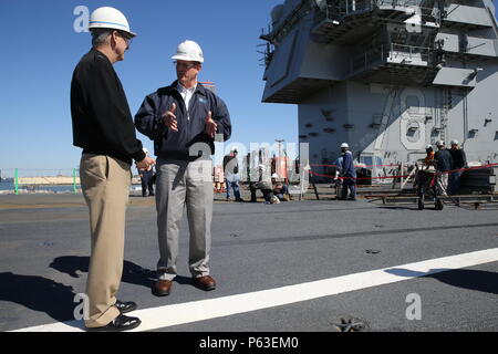 NEWPORT NEWS, Va. (Apr 20, 2016) -- Rear Adm. Thomas Moore takes a tour of Pre-Commissioning Unit Gerald R. Ford (CVN 78) with super intendants of Huntington Ingalls Industries Newport News Shipbuilding (HIINNS). Ford is the first of a new class of aircraft carriers currently under construction by HIINNS. (U.S. Navy photo by Mass Communication Specialist Seaman Apprentice Connor Loessin/Released) Stock Photo