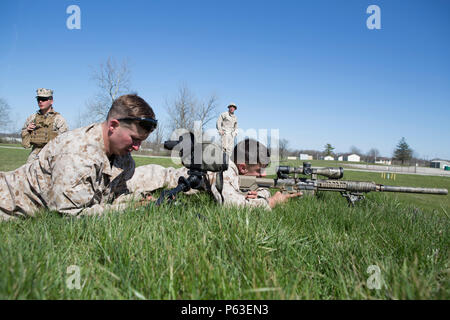 Lance Cpl. John Slager (right) and Lance Cpl. Eric Dragon (left), scout snipers with 2/24 Battalion, 23rd Marine Regiment, 4th Marine Division, Marine Forces Reserve, finish their qualifications on the range during a fire support coordination exercise in Camp Atterbury, Ind.,  April 14, 2016. Along with completing their qualifications the Marines worked with Company B, 8th Battalion, 229th Aviation Regiment (8-229 AV), 11th Aviation Command (Theater), a U.S. Army Blackhawk crew, to hone their skills in casualty evacuations and insertion exercises into enemy lines. (U.S. Marine Corps photo by S Stock Photo