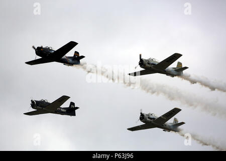 The Trojan Horsemen fly across the flight line prior to the 2016 Marine Corps Air Station Cherry Point Air Show – “Celebrating 75 Years” at MCAS Cherry Point, N.C., April 29, 2016. The Trojan Horsemen are a T-28 Warbird Formation Aerobatic Demo Team is the only six-ship T-28 Warbird formation demonstration team performing in the world today. This year’s air show celebrated MCAS Cherry Point and 2nd Marine Aircraft Wing’s 75th anniversary and is as much fun on the ground as it is in the air featuring 40 static displays, 17 aerial performers, as well as a concert.   (U.S. Marine Corps photo by C Stock Photo
