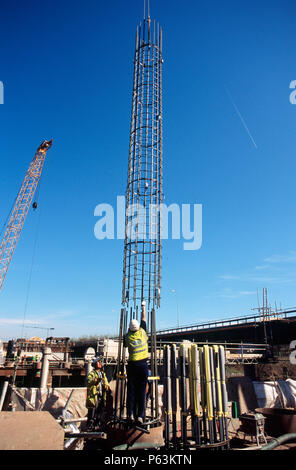 Lowering a reinforcement cage into a bored pile on a bridge foundation for a project in Teeside, UK Stock Photo