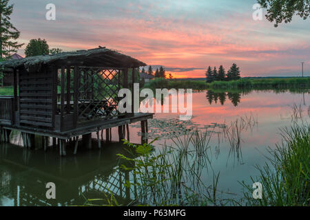 Natural Park of Biebrza Valley - sunrise over medow and pool Stock Photo