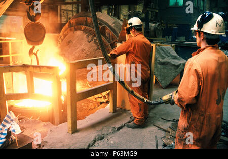 Pouring special steel for rail crossing casts in a foundry near Edinburgh Scotland Stock Photo