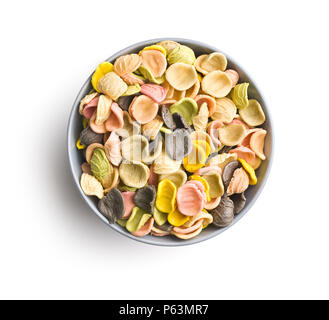 Italian rainbow pasta in bowl isolated on white background. Stock Photo