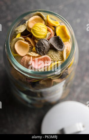 Italian rainbow pasta in jar. Stock Photo