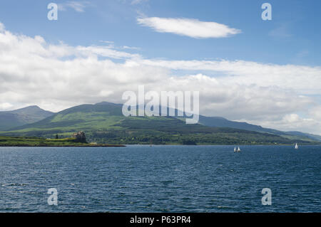 Scenic Isle of Mull seen from the sea, with Duart Castle on the left - Scotland, Great Britain Stock Photo