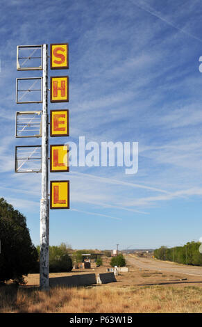A tall Shell sign stands at a closed and abandoned truck stop along Route 66 in Tucumcari, New Mexico. Stock Photo