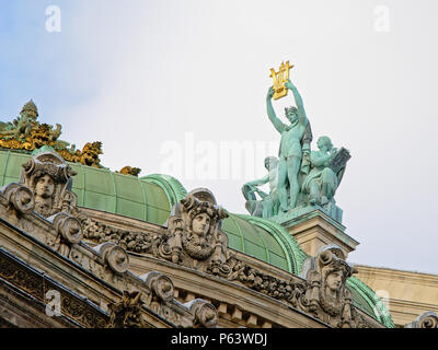 statue of Apolo, Greek god of poetry and music on top of the palais Garnier, opera building of Paris, by Aime Millet Stock Photo