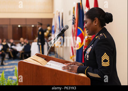 The U.S. Army Reserve concluded its 108th birthday celebration with a military ball, April 23, 2016, at the Iron Mike Conference Center at Fort Bragg, N.C. Master Sgt. Melissa Rolan, recites the symbolism of the POW-MIA table at the ceremony. The Hon. Patrick J. Murphy, Acting Secretary of the Army, addressed U.S. Army Reserve soldiers, officers, and guests at the ball, saying the Army is “America’s varsity team” and needs to be ready at a moment’s notice. And the U.S. Army Reserve is an integral part of the team. When the President or these governors ask us to respond, we can’t say, ‘I’m sorr Stock Photo