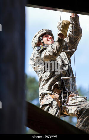 Participants from team three climb Jacob’s Ladder, the first obstacle ...