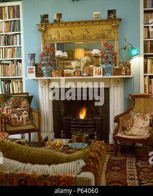 Mirror above fireplace in Victorian dining room with gilt framed Stock ...