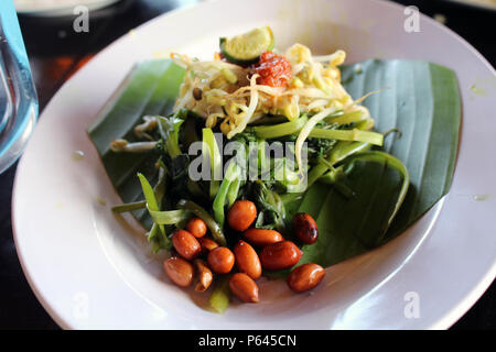 Plecing kangkung, a traditional salad dish from Lombok or Bali, Indonesia. Stock Photo