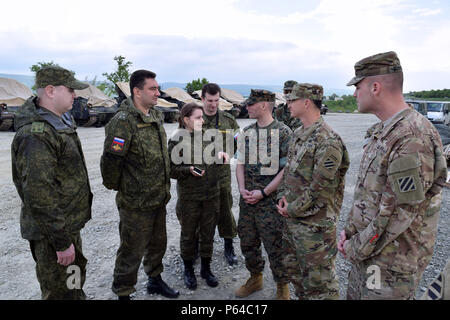 Soldiers from 1st Battalion, 64th Armor Regiment meet with a Russian inspection team at Bulgaria's Novo Selo Training Area April 20. The inspection falls under the Vienna Document 2011 Confidence and Security-Building Measures and demonstrates the transparency of the U.S. Army’s training in Europe. (Photo by Spc. Ryan Tatum) Stock Photo