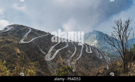 Three Level Zigzag road is probably the most dizzying road in the world. Located in the Sikkim Indian state, in the Himalayan mountains, the road incl Stock Photo